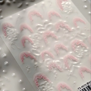 Pink lace bow nail art stickers with 3D embossed texture and dreamy romantic patterns