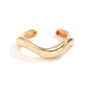 Polished 18k gold irregular wave open bangle bracelet in stainless steel with a glossy finish