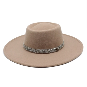 Detail of camel wool fedora with sparkling rhinestone band and golden M emblem decoration