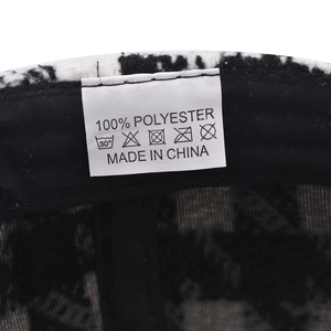 Detail of 100% polyester cap washing label and interior mesh lining for comfort