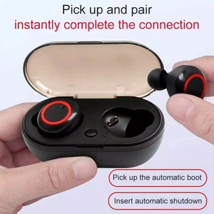 Detail of TWS wireless earbuds being held, showing auto-pairing feature and charging case
