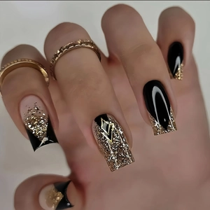 Square French press-on nails with black and gold glitter gradient and rhombus charm