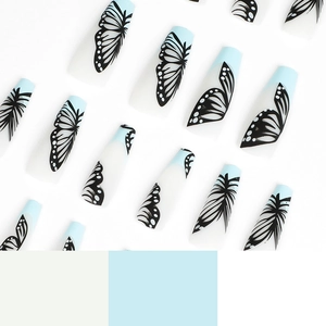 Blue and white ballerina press-on nails with intricate black butterfly wing patterns