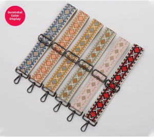 Detail showing six ethnic jacquard bag straps with gunmetal hardware and patterns