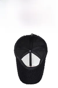 Detail of black lamb wool baseball cap featuring breathable mesh lining and inner embroidery