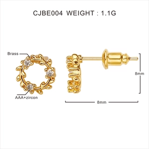 Macro shot of 18k gold plated laurel wreath stud earrings with AAA cubic zirconia
