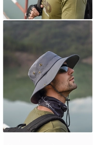 Détail du chapeau de soleil gris avec aérations métalliques et cordon de serrage réglable