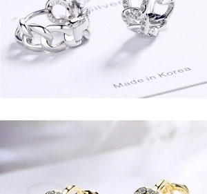 Close-up of S925 silver chain and heart earrings with cubic zirconia inlay details