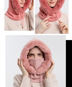 Detailed texture of pink knitted winter hood scarf with adjustable drawstrings and faux fur trim