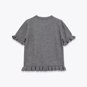 Minimalist grey short sleeve knit top with ruffled cuffs and hem on light grey background