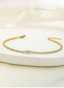 Detail of a gold titanium steel tennis bracelet with sparkling cubic zirconia crystals
