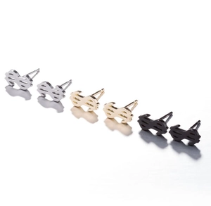 Macro detail of dollar sign stud earrings in silver, gold and black stainless steel