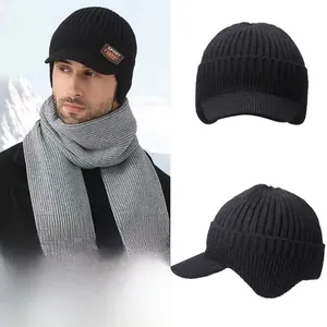 Close-up of dual-layer thermal knit hat with earflaps and SPORT leather patch detail