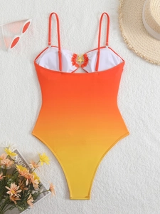 Costume da bagno intero sfumato arancione e giallo con decoro a forma di stella marina