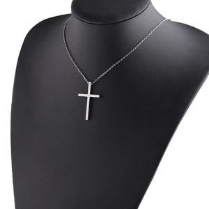 Polished stainless steel cross pendant necklace displayed on a black neck mannequin
