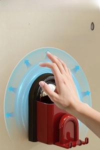 Macro shot of magnetic toothbrush holder with red suction cup for fast wall mounting