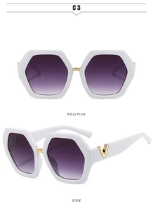 Detail view of white hexagonal oversized sunglasses with gradient purple lenses and V-logo