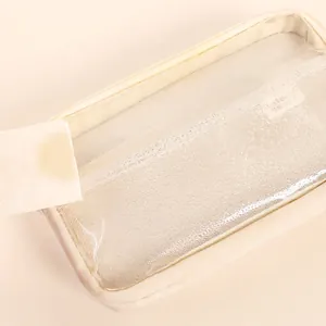 Waterproof clear PVC pencil case for students featuring a beige frame and smooth zipper