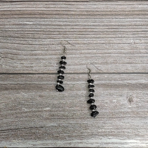 Bohemian handmade long tassel earrings featuring natural black raw stones and silver beads
