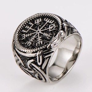 Macro view of vintage silver Viking Vegvisir compass ring with engraved Nordic runes