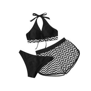 Three-piece women swimsuit with halter bikini top and chevron print sports shorts