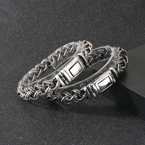 Macro view of vintage silver braided titanium steel bracelet with antique finish details
