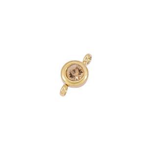 Macro detail of a 6.5mm gold-plated stainless steel birthstone charm with double loops