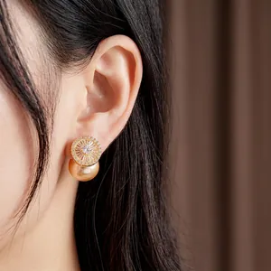 French vintage gold earrings with sparkling zircons and a large elegant pearl