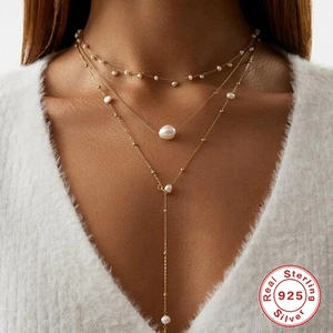 Elegant gold S925 sterling silver three-layer pearl necklace on a model