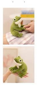 Detail of cute green plush frog showing soft material and compact size in hand