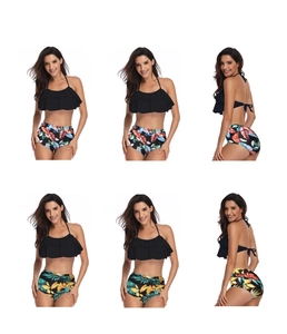 Detail view of high-waisted bikini sets featuring ruffle tops and tropical floral prints