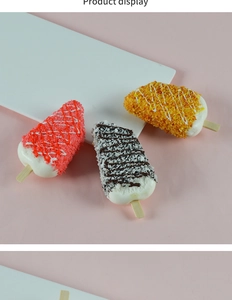Detailed view of three colorful PU faux ice cream popsicles with wooden sticks on pink background