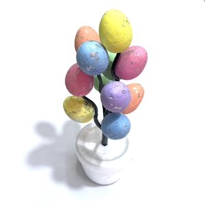 Easter egg tree decoration with colorful speckled pastel eggs in a small pot