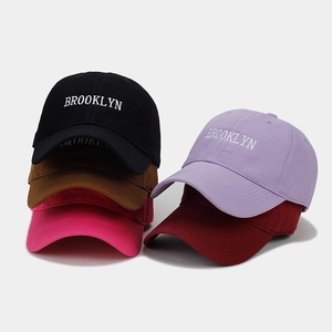 Detail of multi-color Brooklyn embroidered baseball caps in cotton twill fabric