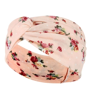 Detail of pink floral yoga headband with retro paisley print and twisted knot design