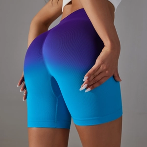 Rear view of seamless high-waist yoga shorts featuring a purple to blue gradient design