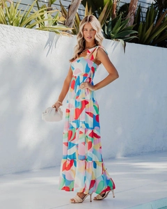 Detail of colorful abstract floral maxi dress with spaghetti straps and tiered skirt