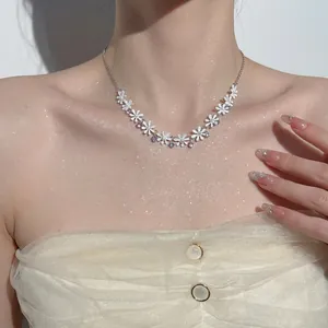 Elegant floral necklace with white daisies, faux pearls and crystals on silver chain