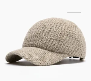 Detailed view of khaki knitted baseball cap with textured ribbing and adjustable buckle