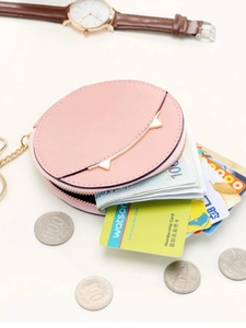 Pink round mini coin purse with gold zipper shown with coins and cards on white background