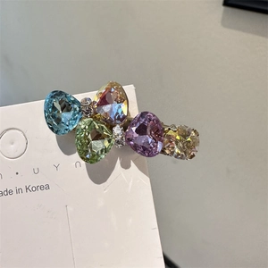 Barrette à cheveux raffinée en cristal avec cinq pierres facettées colorées sur métal