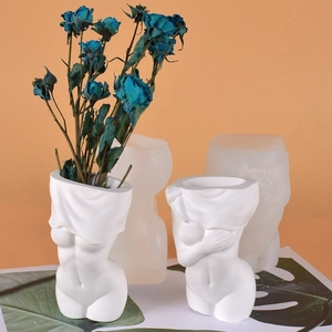 Detail of DIY silicone mold and finished female body art vase with matte texture