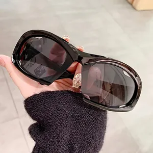 Y2K sporty cycling sunglasses with oversized black frame and dark tinted lenses