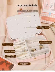 Detail view of pink PU leather jewelry box with necklace hooks and ring slots