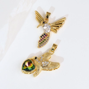 Golden hummingbird pendant charms with vibrant heart and teardrop crystal inlays