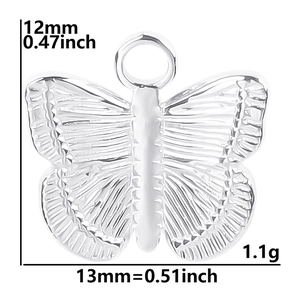 Macro detail of butterfly pendant showing dimensions 12x13mm and 1.1g weight specification