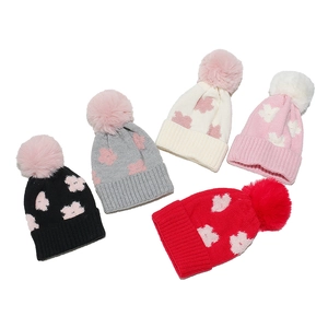 Cozy knit flower beanies for baby girls with pom-poms in five assorted bright colors