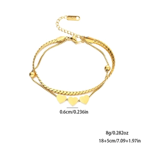 Double-layered golden stainless steel heart bracelet with polished charms and K18 hallmark