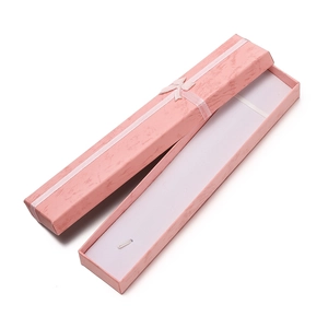 Detailed view of pink necklace gift box featuring cloud texture and silk ribbon bow