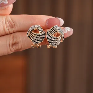 Vintage gold and black enamel wing earrings with sparkling zircon stones for women